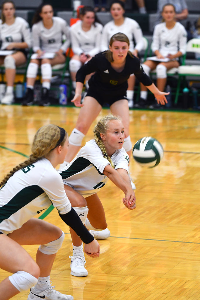 Lily Dudley passes the ball during the Rock Bridge versus Hermann volleyball game